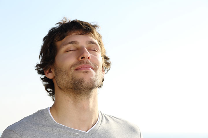 A man taking smelling the air