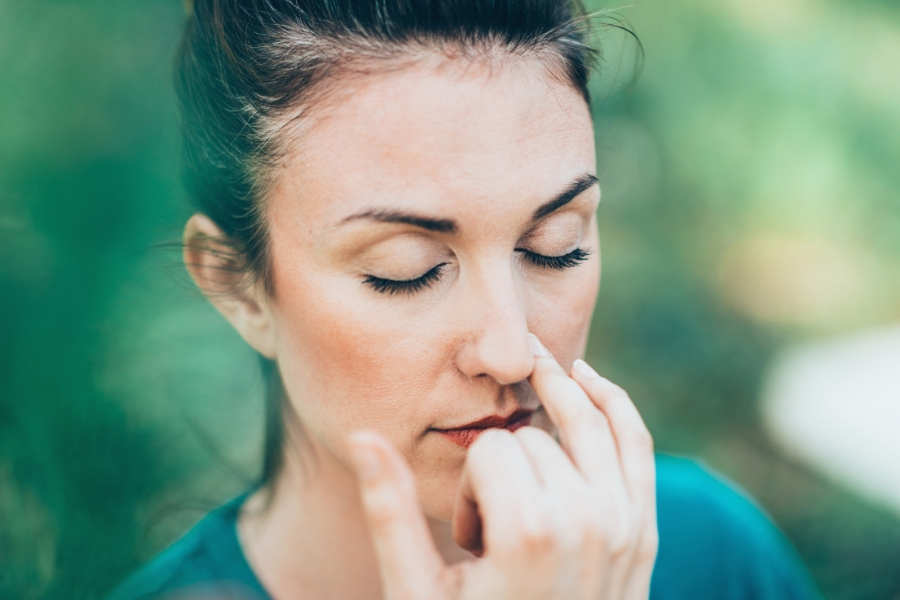 Woman who has nasal obstruction having difficulty breathing