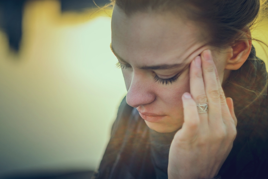 woman suffering with sinus headache and pressure