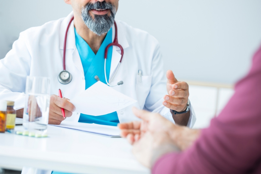 Ear Nose and Troat Doctor talking with a patient