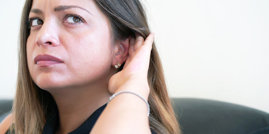 Close up Female Holding Her Hand Over Her Ear