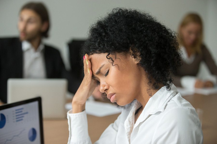 African American Businesswoman Suffering from a Migraine