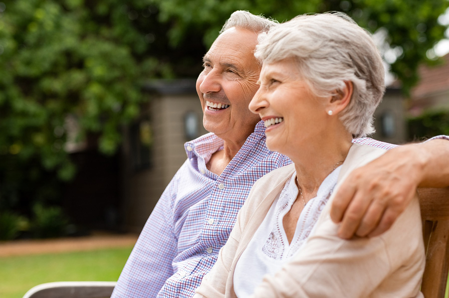 Senior couple sitting together relief