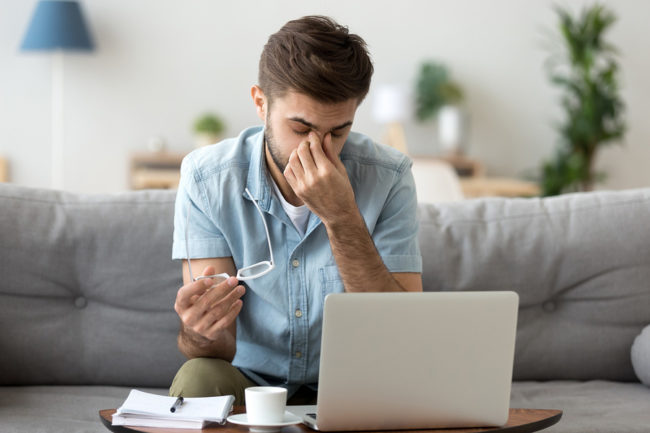 Young Man Feeling Sinus Headache Behind His Eyes