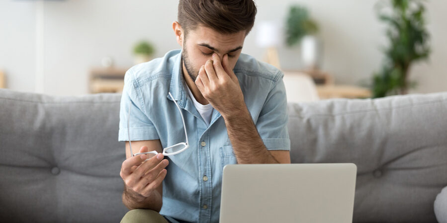 Young Man Feeling Sinus Headache Behind His Eyes