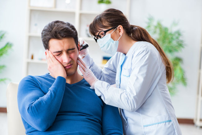 ENT Doctor checking a patient's ear