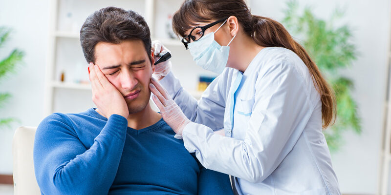 ENT Doctor checking a patient's ear