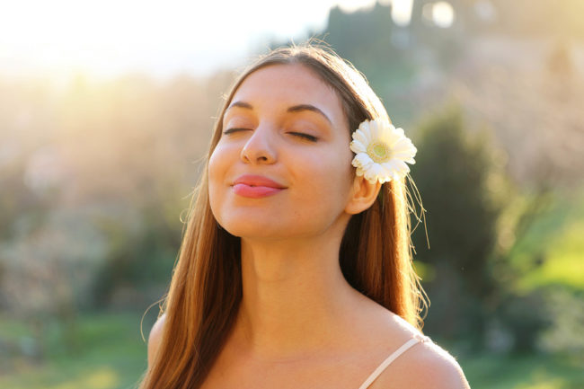 Close Up Portrait Of Woman Breathing Better during the spring with healthy sinuses