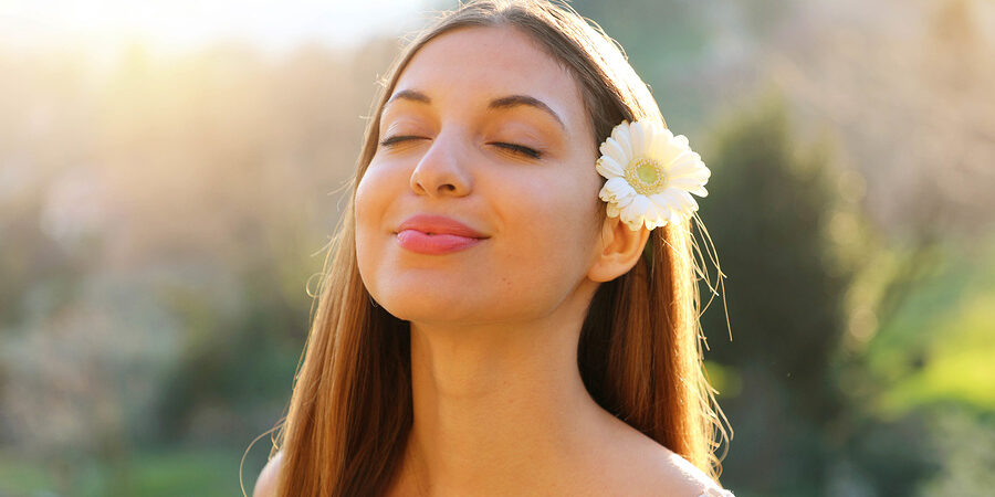 Close Up Portrait Of Woman Breathing Better during the spring with healthy sinuses