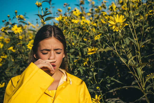 The Girl Suffers From Pollen Allergies stuffy nose sinus problem